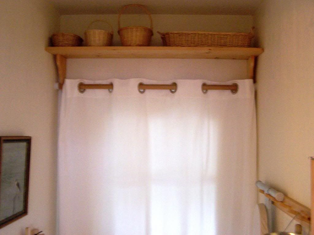  the space above the door by adding a shelf to store empty baskets title=